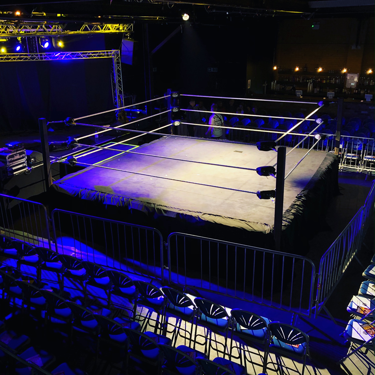 Wrestling ring in dimly lit XOYO Birmingham, ready for high-energy performances.