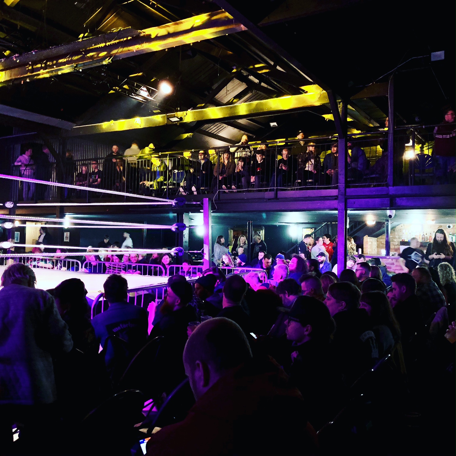 "Vibrant event space in XOYO Birmingham with elevated audience area for wrestling events."
