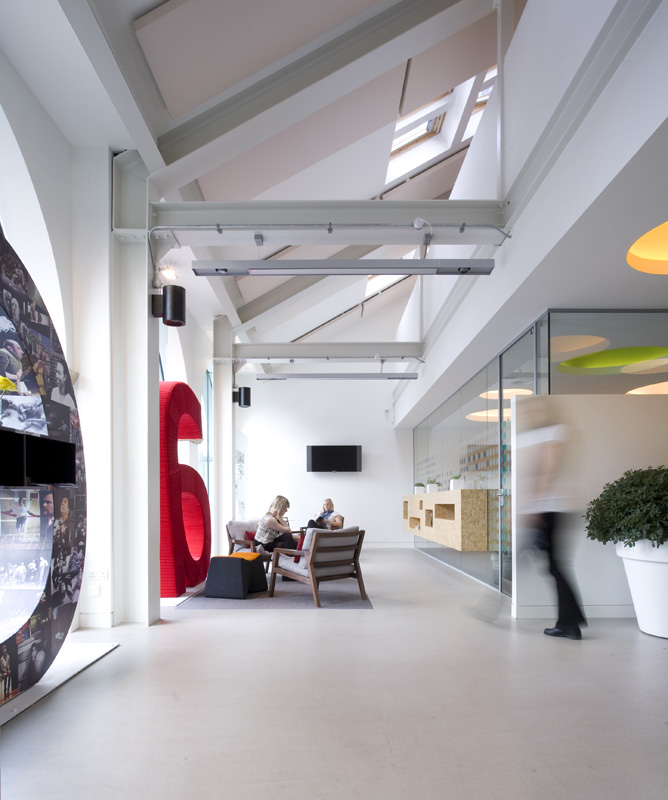 Modern meeting room with glass walls for networking at Graeae Theatre Company.