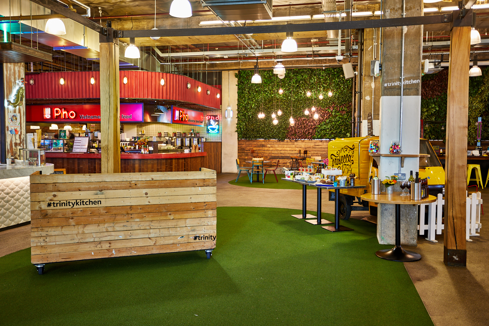 Urban Park food hall with greenery, ideal for casual gatherings and networking events.
