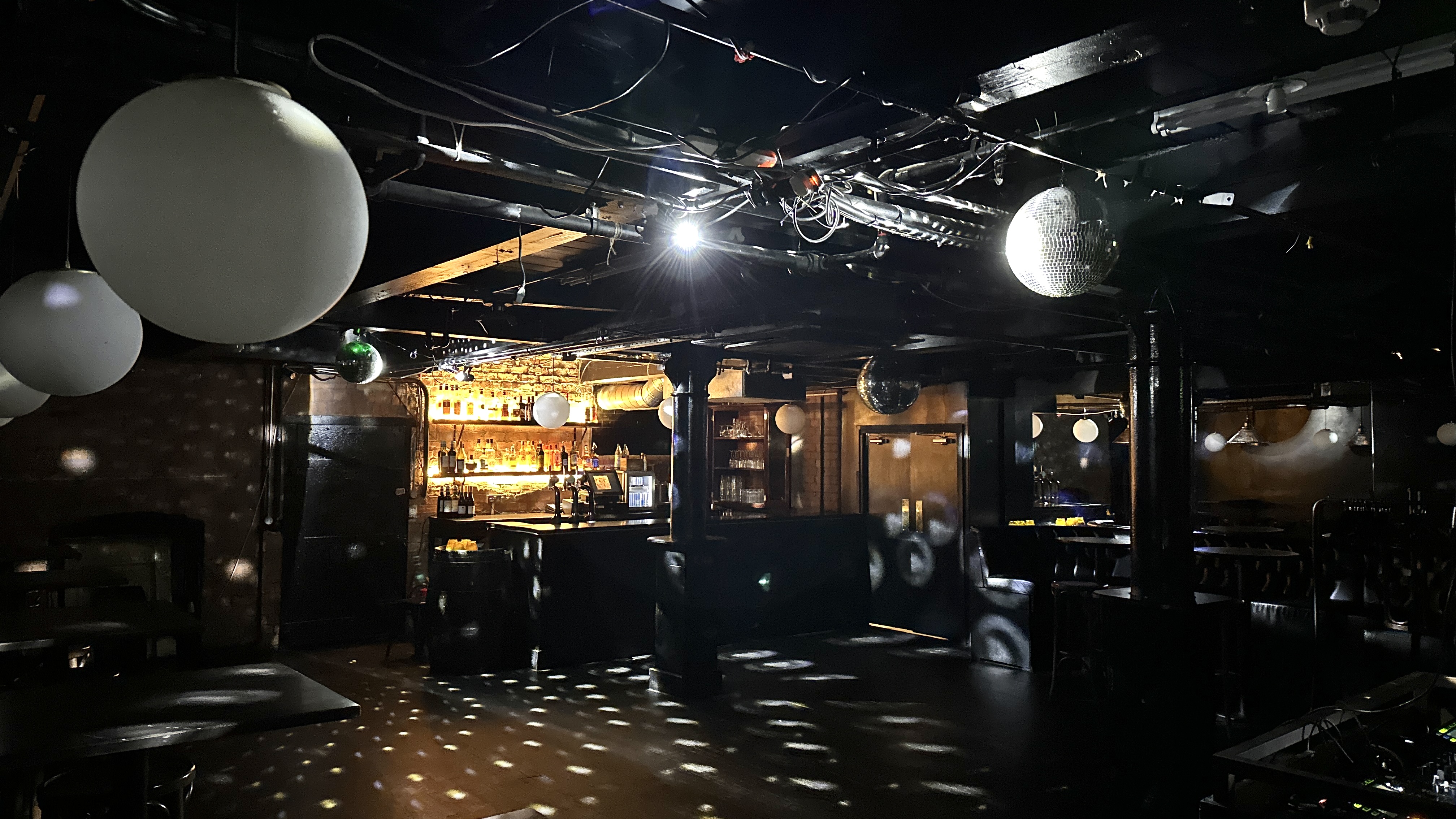 Versatile event space with bar and ambient lighting for parties and gatherings.