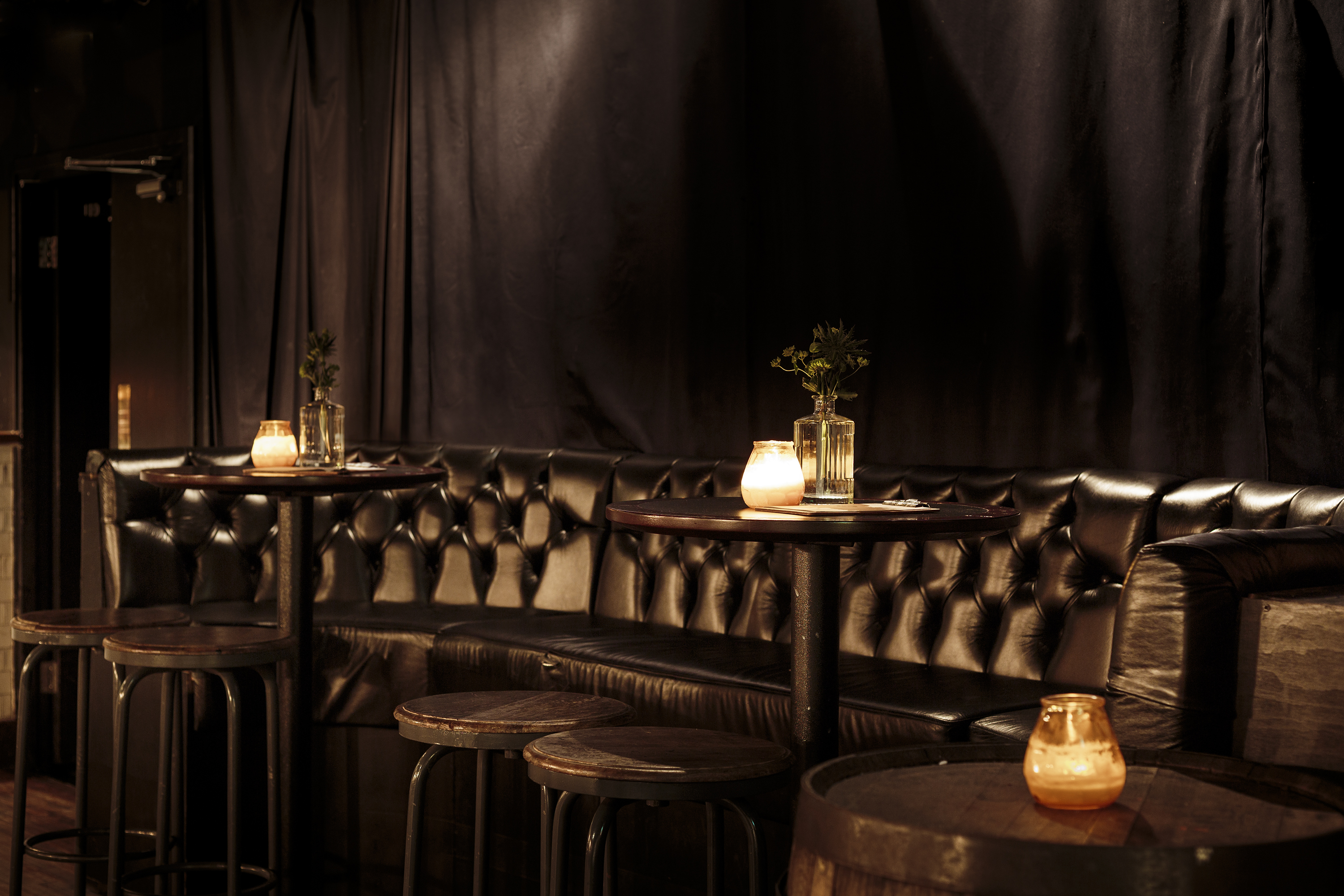 Intimate Whiskey Jar Basement venue with plush seating for networking events.