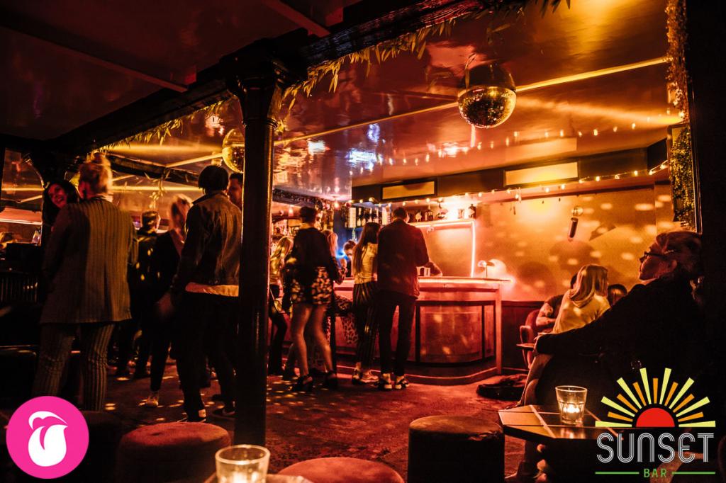 Vibrant event space with disco balls, perfect for cocktail receptions and gatherings.