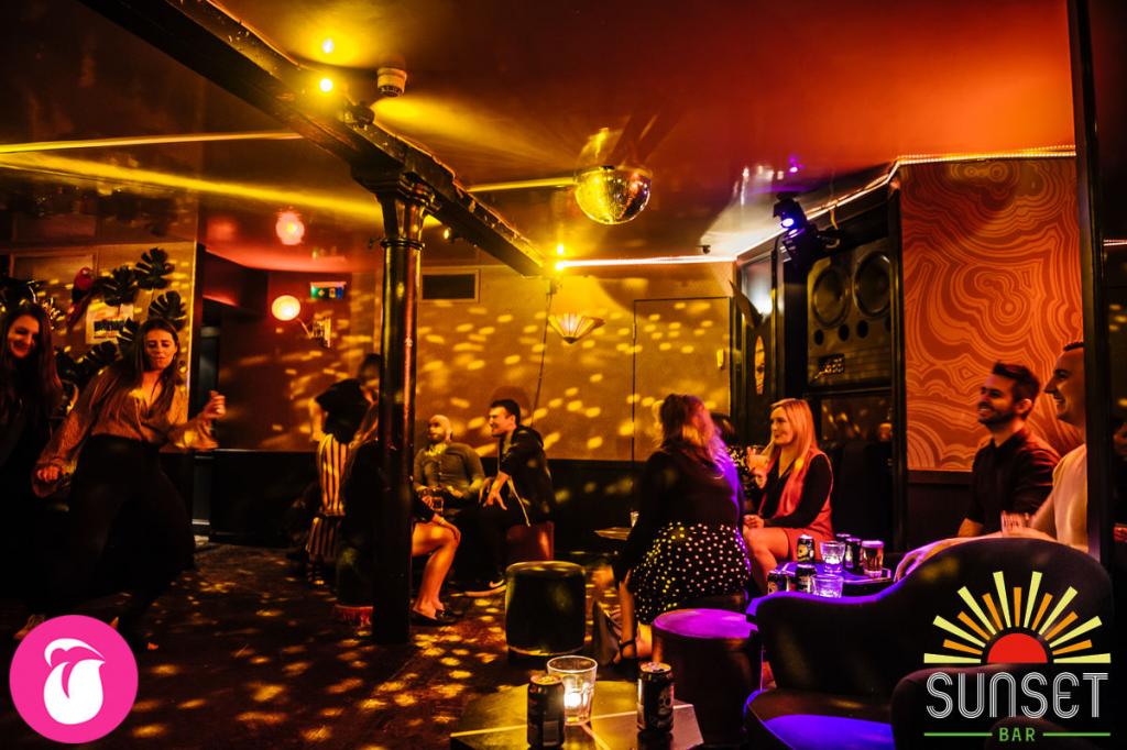 Vibrant event space with dynamic lighting for social gatherings and networking.