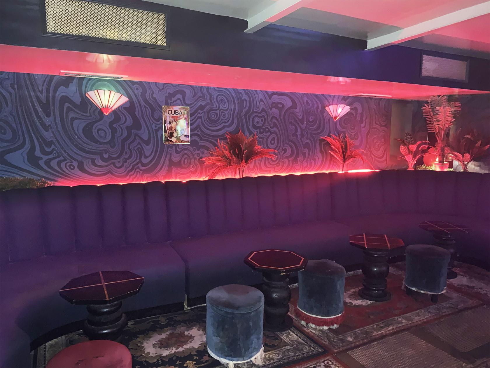 Stylish lounge area with plush seating for networking events at Sunset Bar.