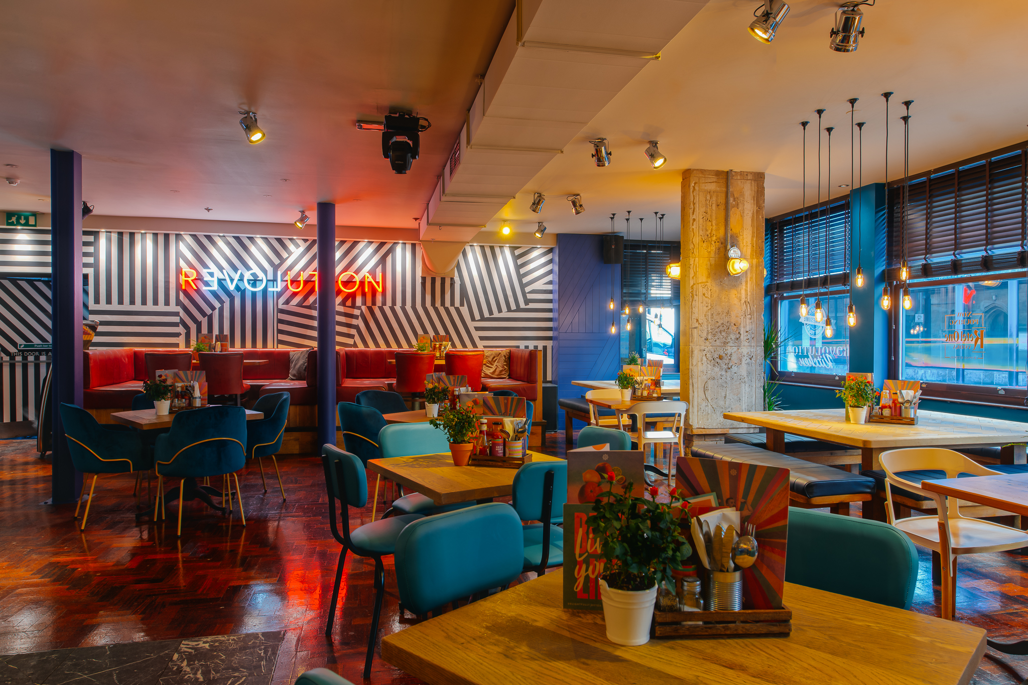 Vibrant event space in Revolution Cambridge with colorful seating for networking events.