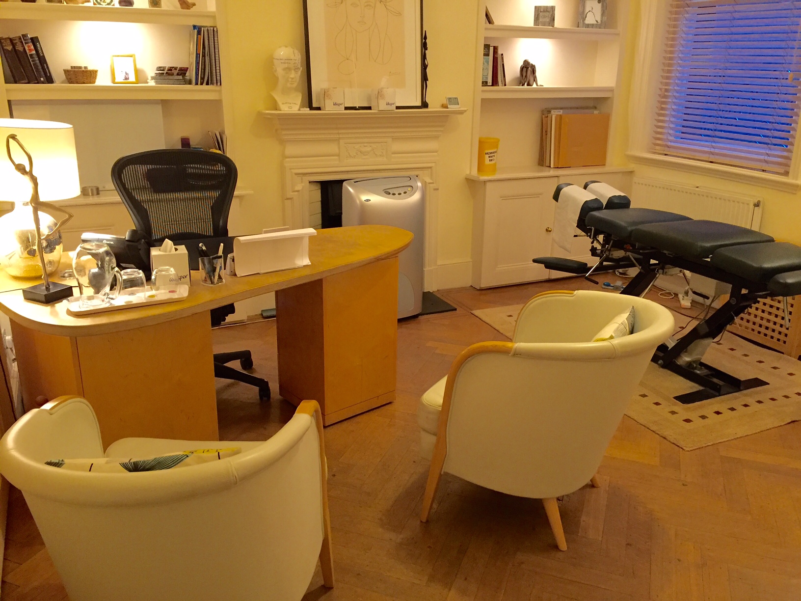 Consulting Room 4 at Wilbraham Place, featuring a treatment table for wellness events.