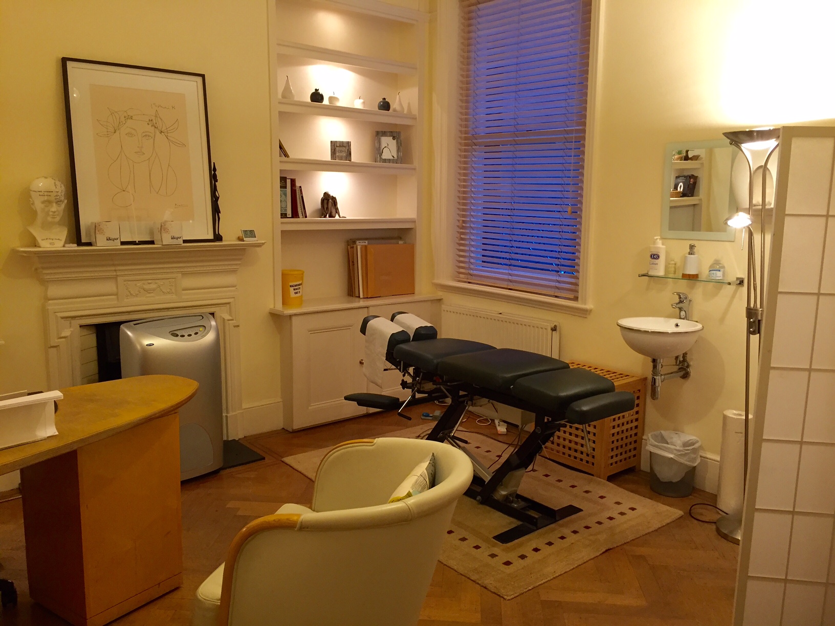 Serene wellness treatment room with a massage table for corporate retreats and relaxation events.