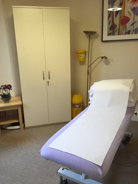 Clean consulting room with organized storage for efficient event space management.