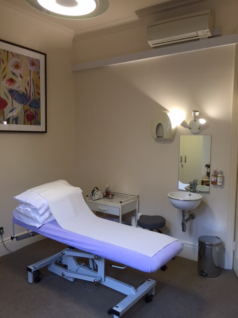 Wellness treatment room with massage table for retreats and conferences.