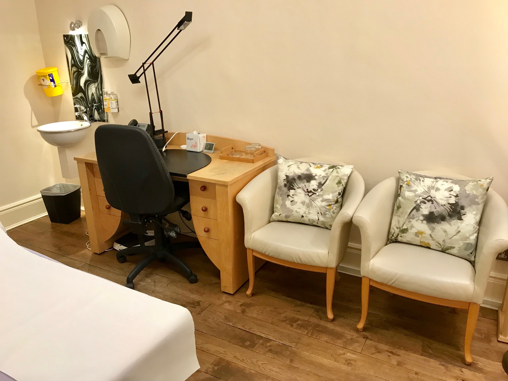 Consulting Room 8 at Wilbraham Place: clean desk, ideal for meetings and planning sessions.