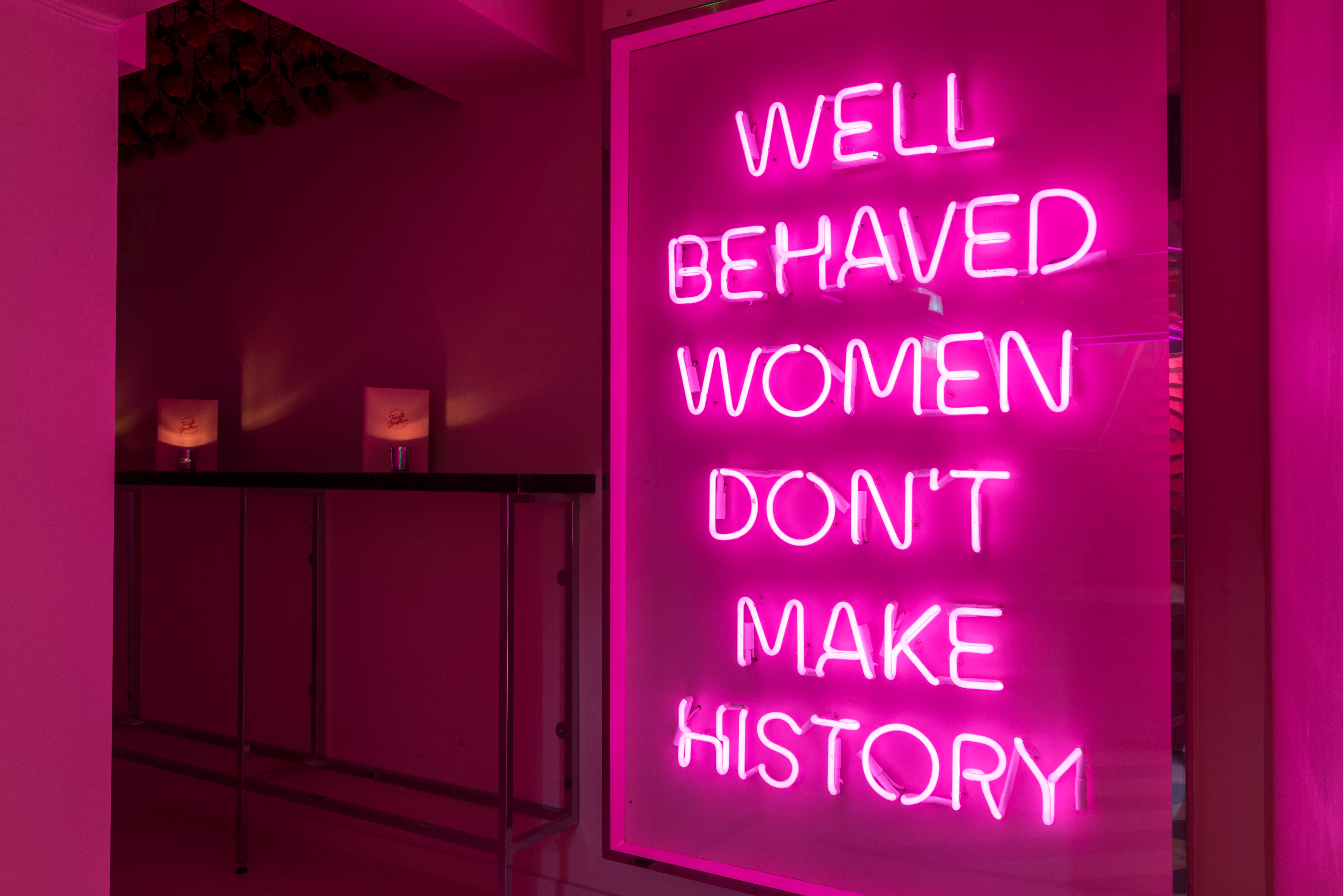 Vibrant neon sign at Tonight Josephine Shoreditch for women's empowerment events.