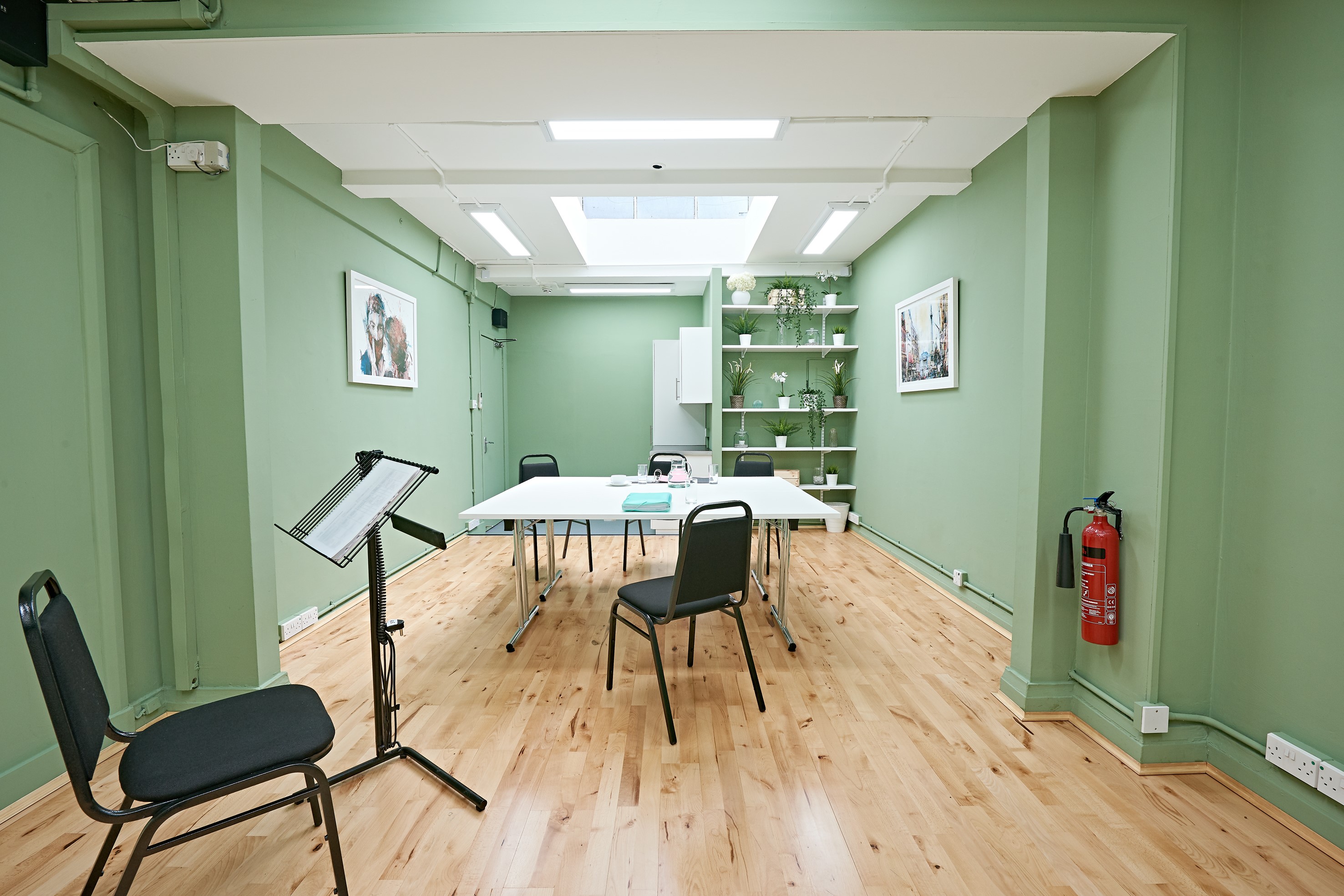 Whitehall Studio at Trafalgar Theatre, green walls, ideal for workshops and meetings.