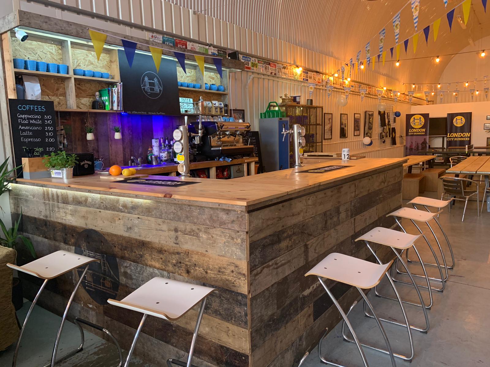 Modern bar area in London City Runners, ideal for networking events and casual meetings.
