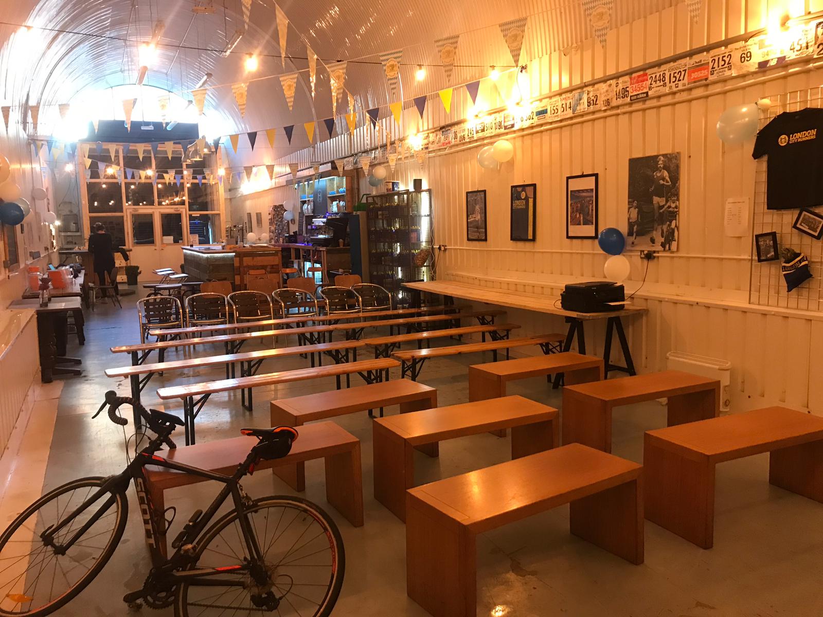Versatile London event space with wooden benches, ideal for workshops and cycling events.
