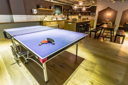 Modern cafe venue with ping pong table for team-building and networking events.