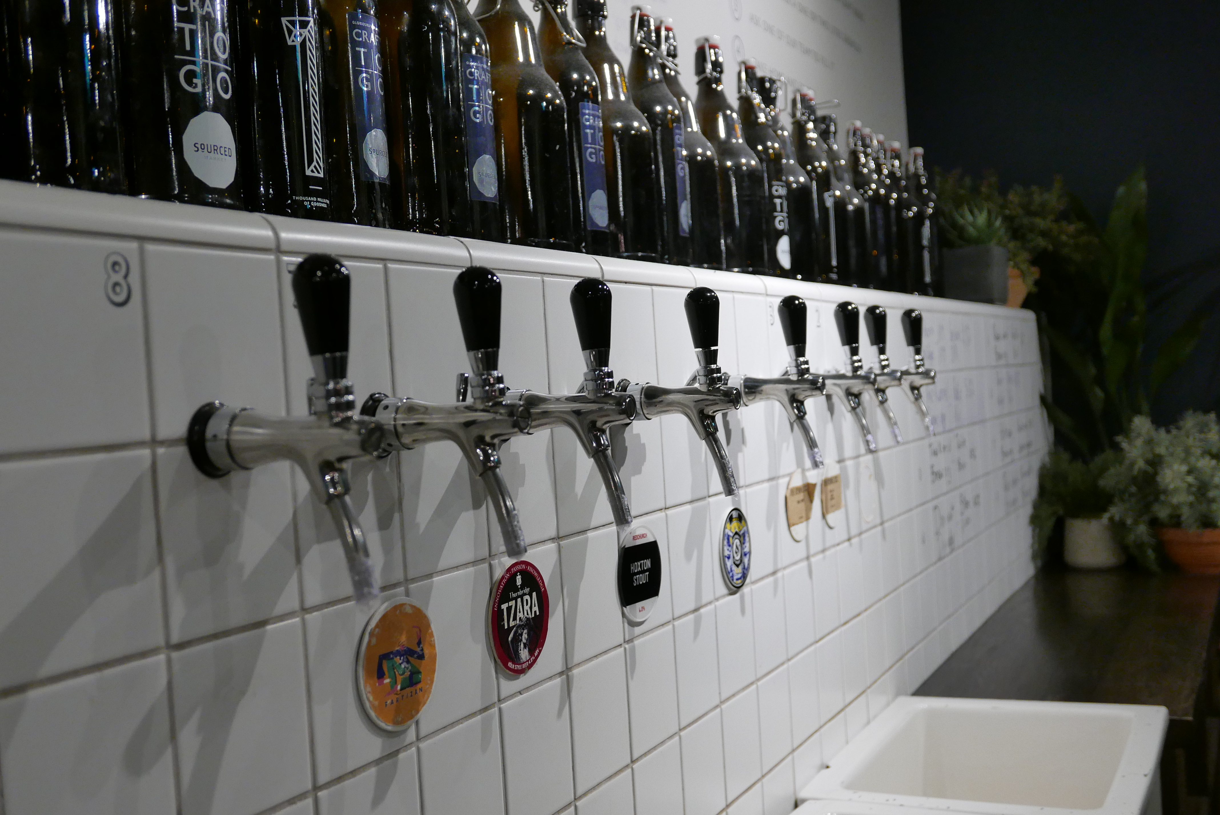 Sourced Market Marylebone: sleek beverage tap wall for craft drink events and social gatherings.