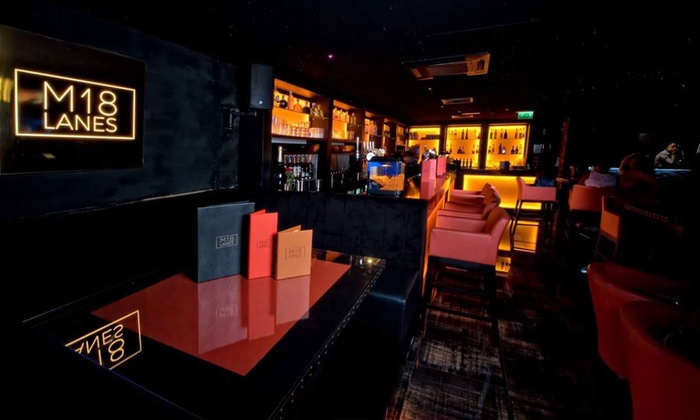 Modern bowling lanes in M18 Restaurant, perfect for networking events and gatherings.