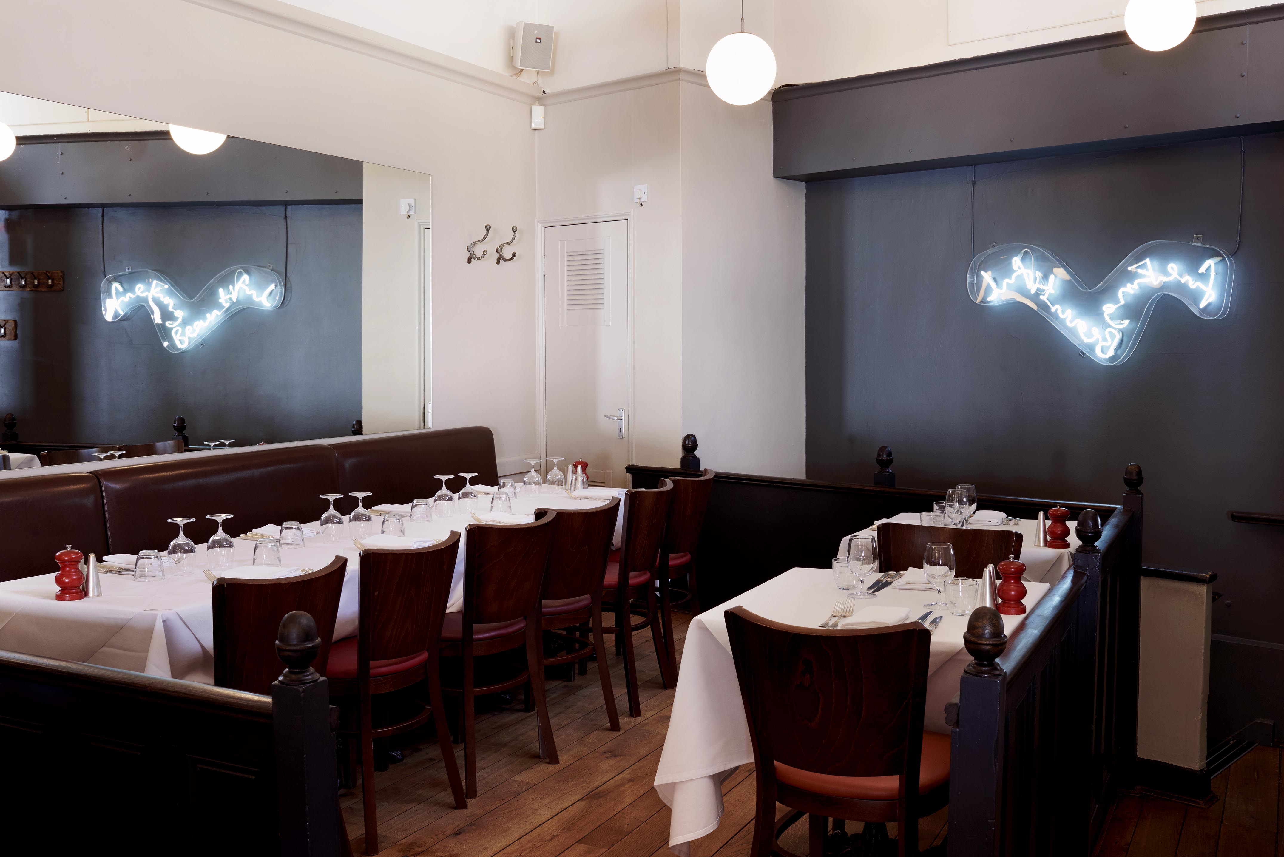 Stylish HIX Oyster & Chop House restaurant with elegant table settings for private events.