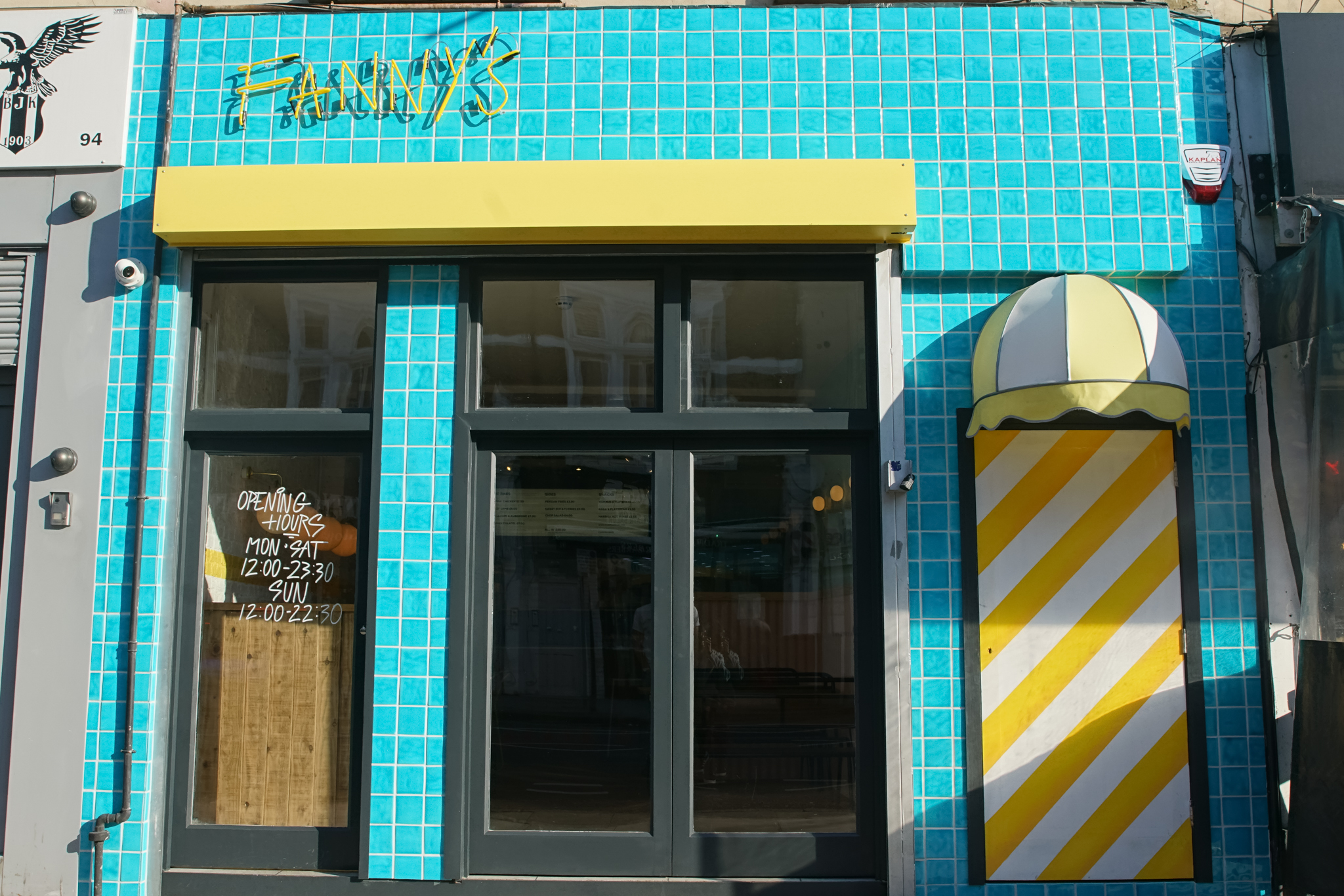 Vibrant Fanny's Kebabs venue with turquoise tiles, perfect for casual gatherings and events.