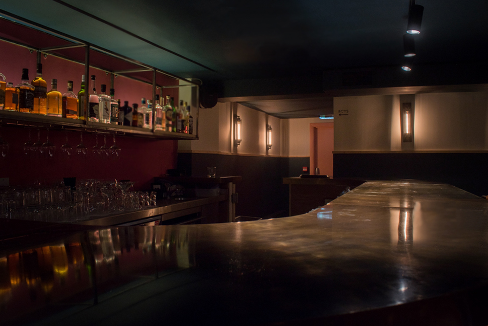 Sleek modern bar at Fanny's, perfect for cocktail receptions and networking events.