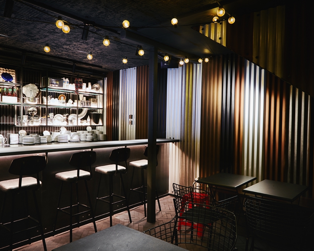 Stylish Bangkok Underground venue with sleek bar, perfect for networking events.