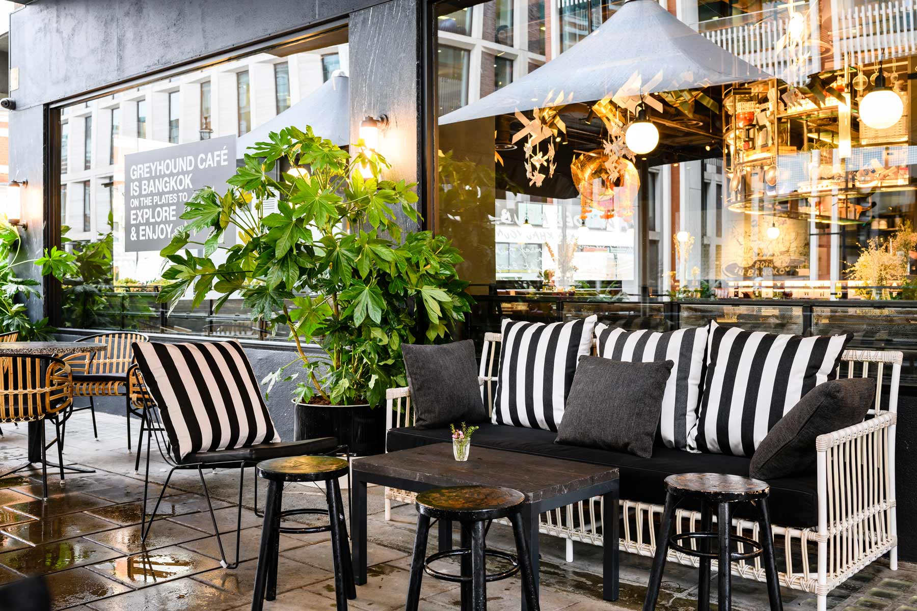 Stylish outdoor seating at The Greyhound Cafe, perfect for networking events and casual meetings.
