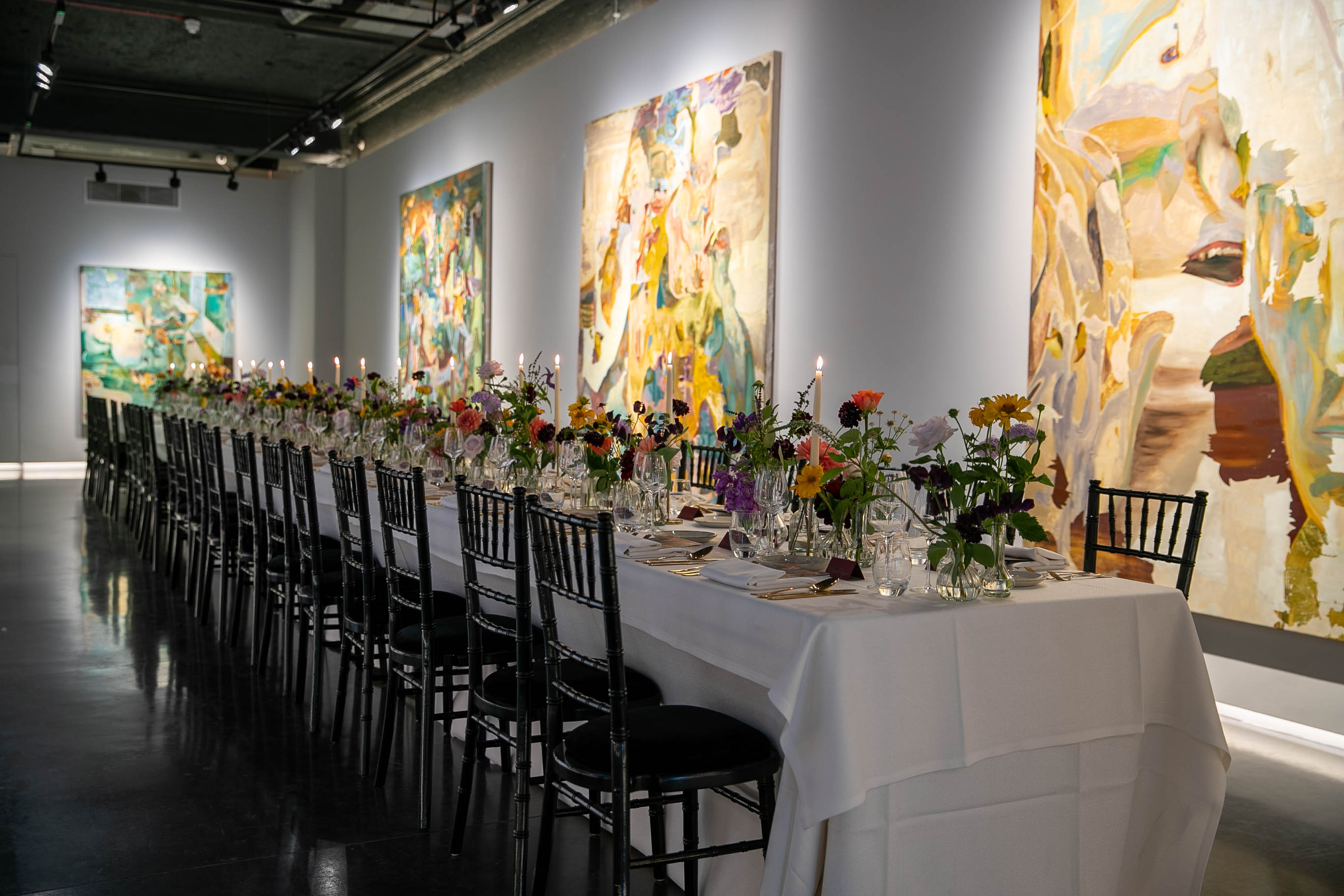 Elegant dining table with floral centerpieces in Main Gallery, ideal for gala events.