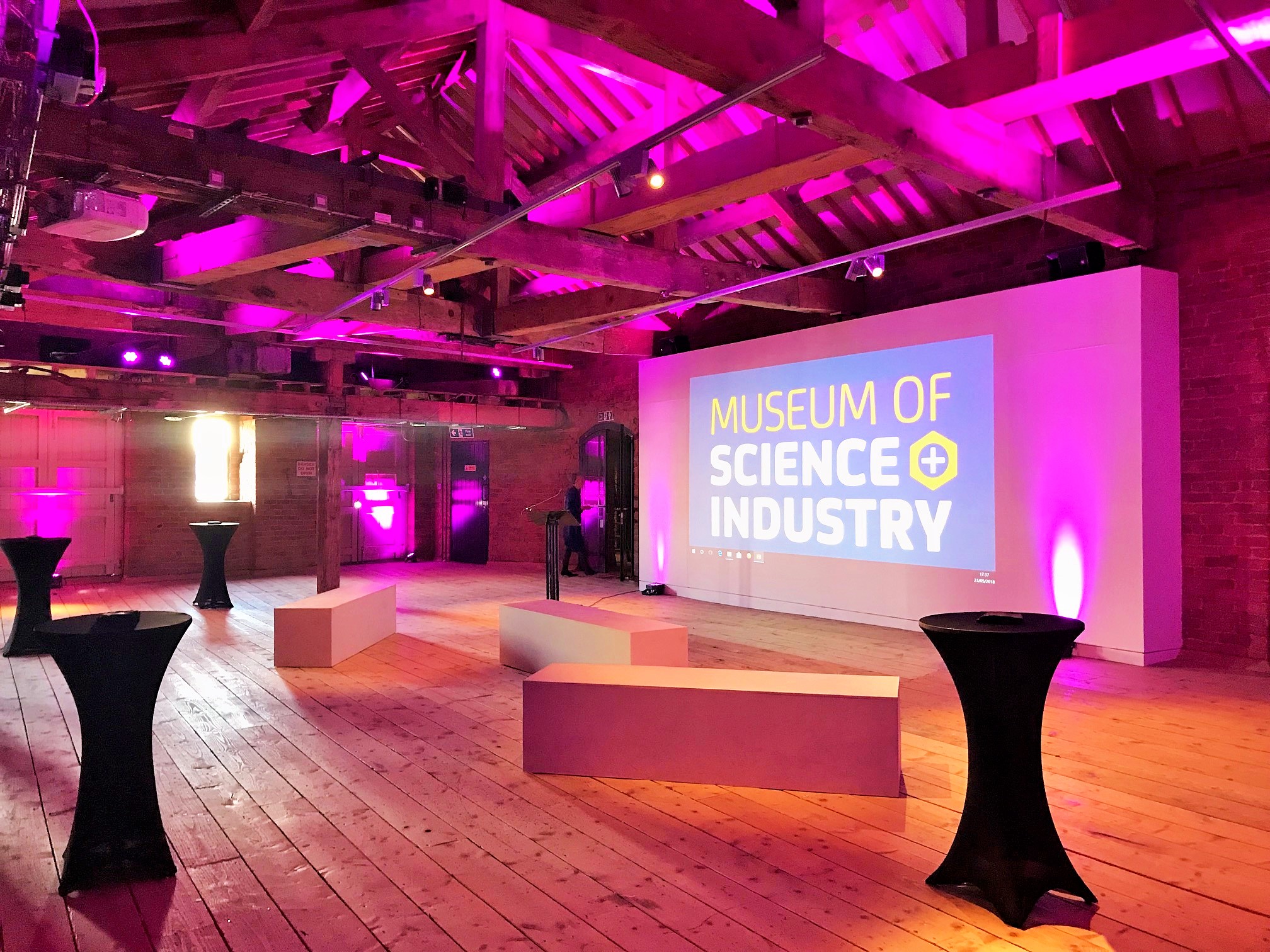 1830 Warehouse event space with modern lighting for conferences and workshops.