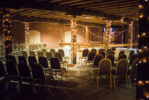 1830 Warehouse event space with rustic beams, ideal for corporate meetings and social events.