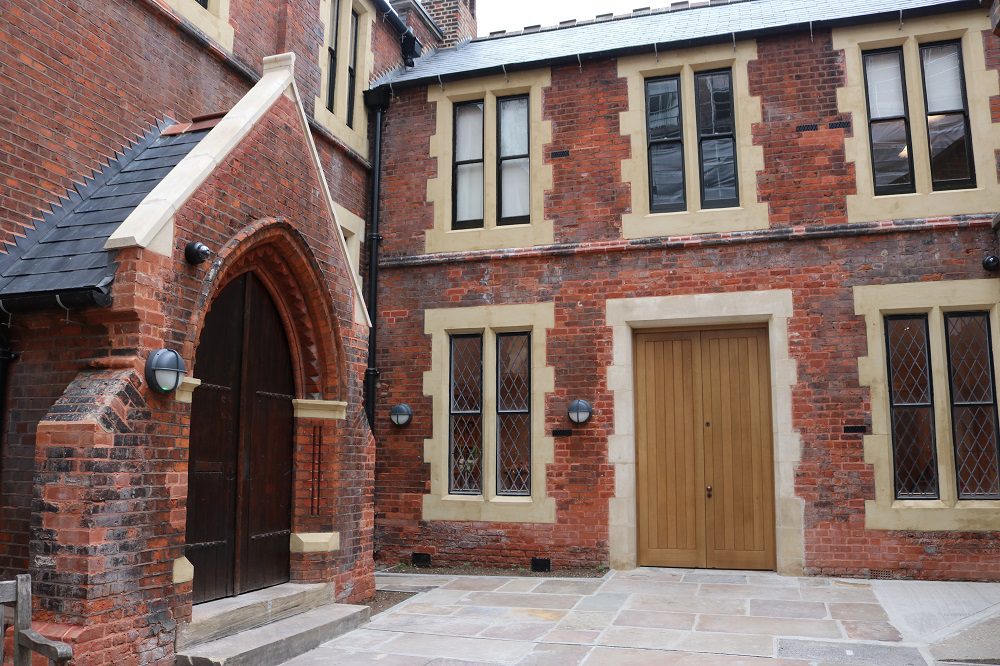Lecture Hall at Toynbee Hall, brick venue with large windows for events and meetings.