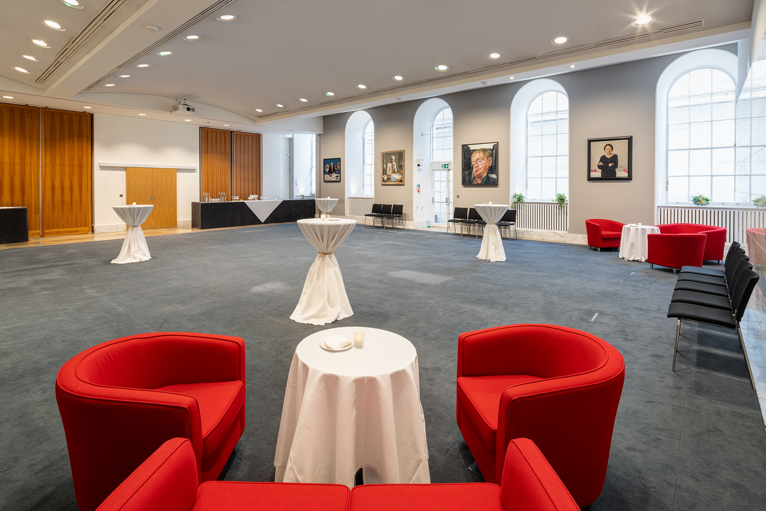 Dining Room at The Royal Society with stylish red chairs, perfect for receptions and networking.