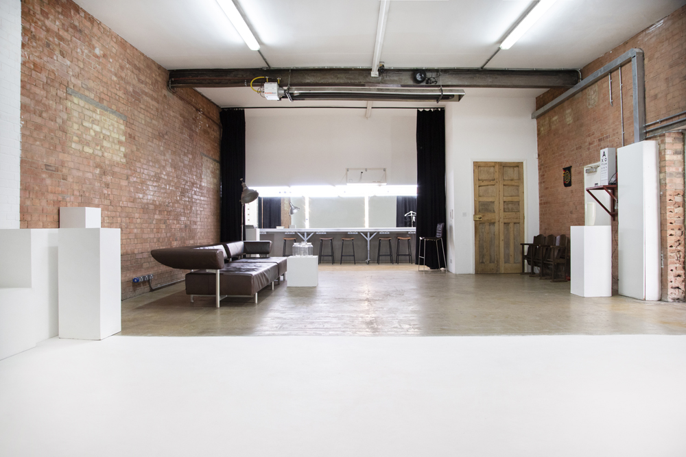 Versatile event space in Bow Bunker, East London with exposed brick walls.