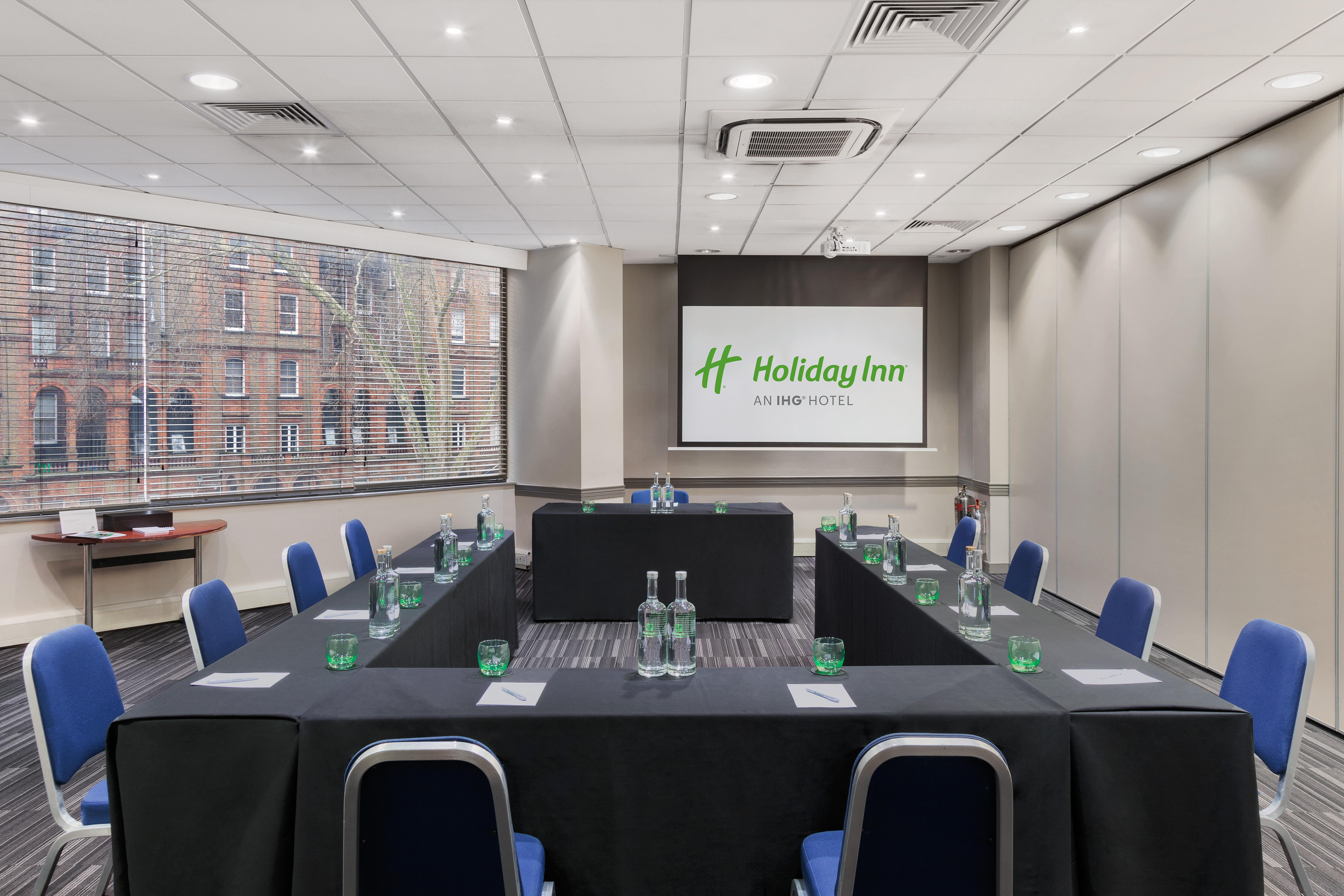 Madonna in a bright meeting room at Holiday Inn Kensington, ideal for corporate events.