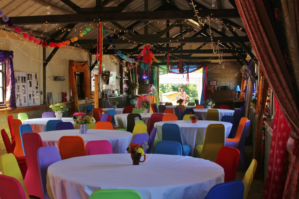 Vibrant event space at Barnutopia with colorful chairs, ideal for workshops and celebrations.