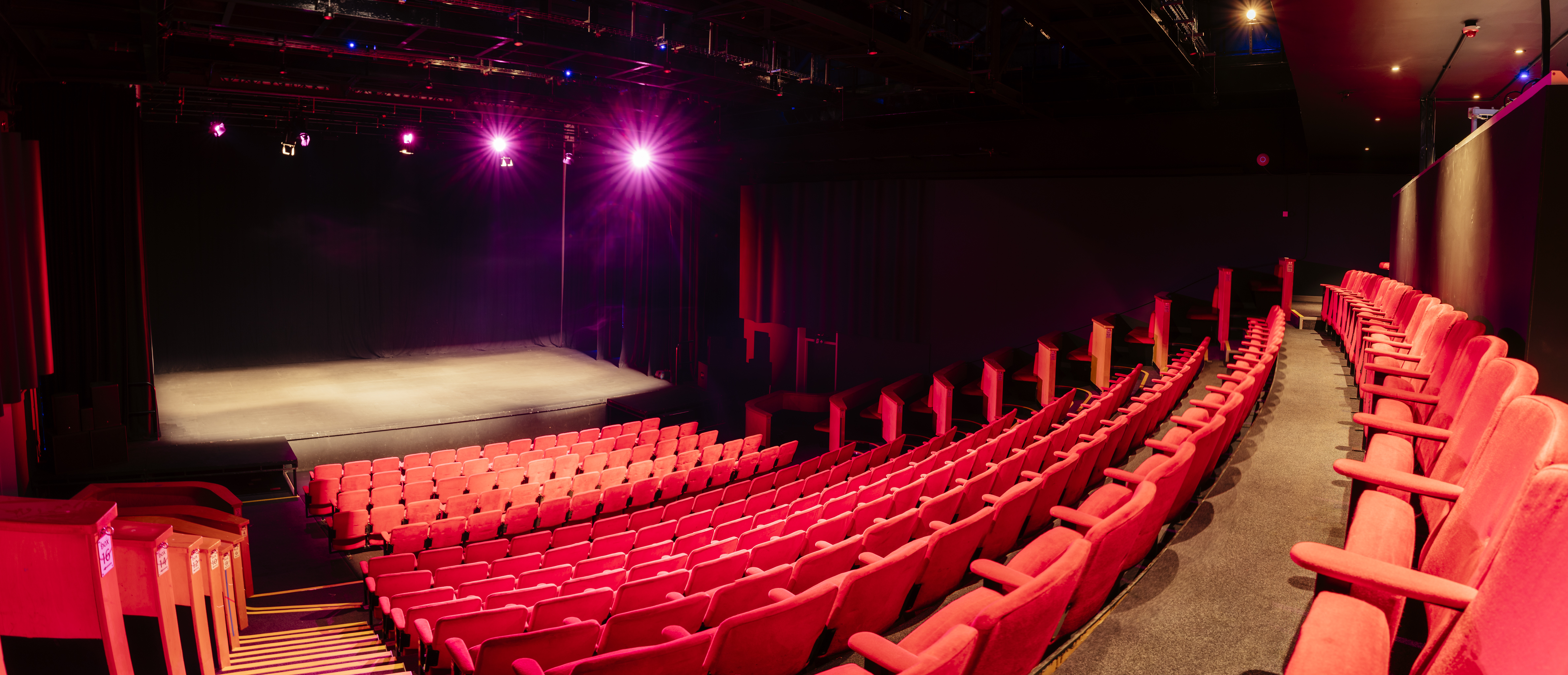Alt text: "Contact Theatre Space 1 with tiered seating for presentations and performances."