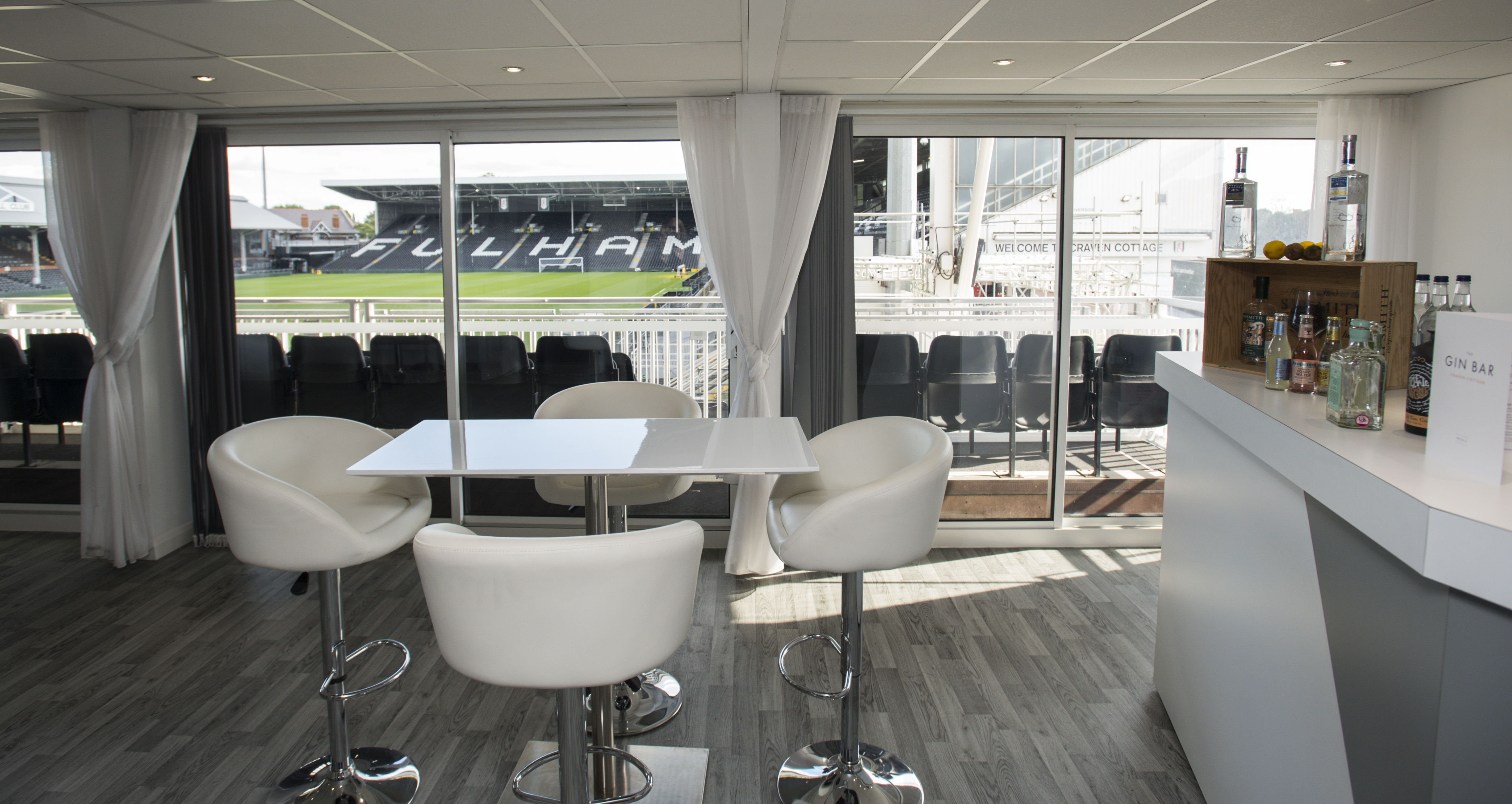 Sleek Gin Bar at Fulham FC, ideal for networking events with stadium views.