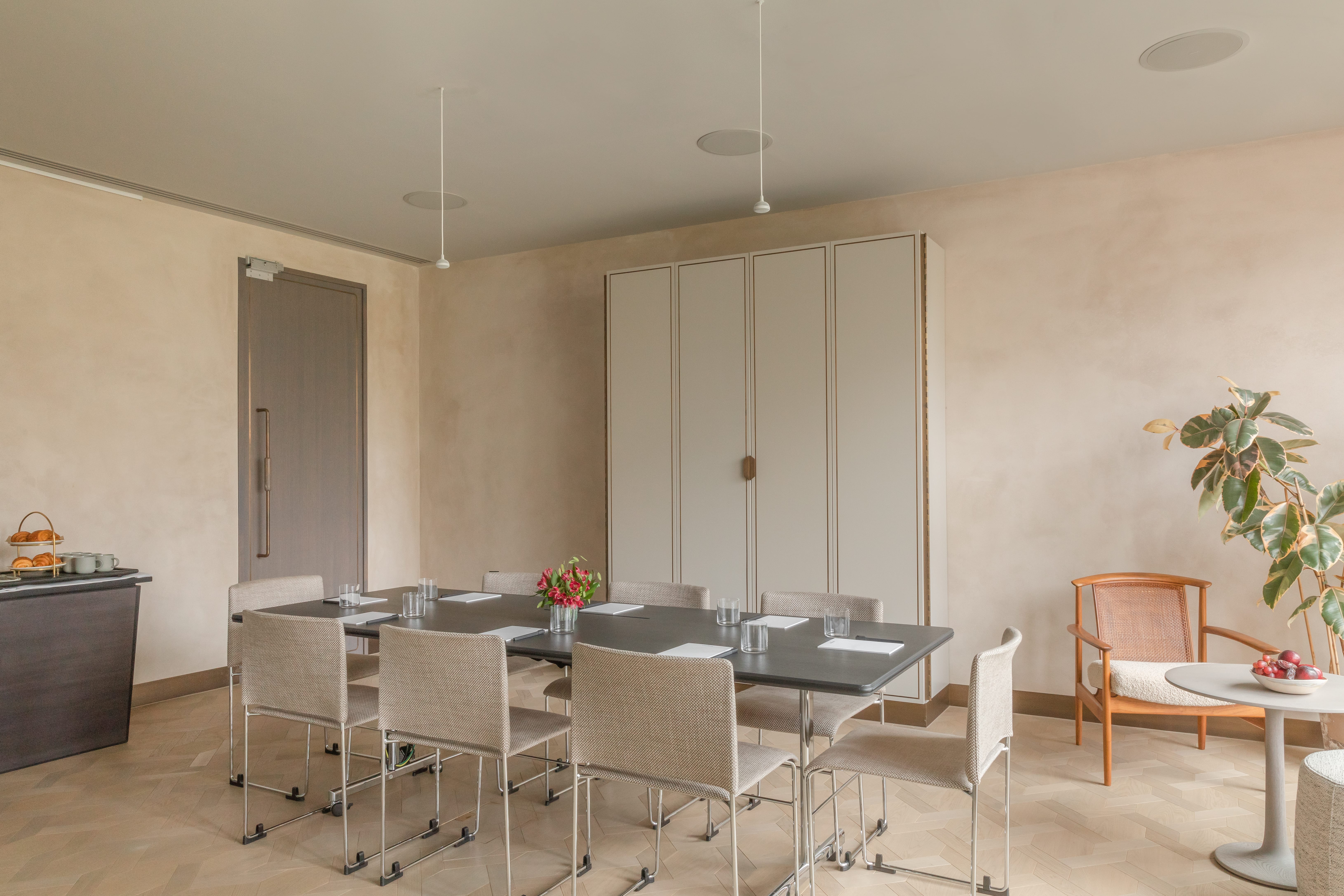 Modern meeting room at The Stratford, featuring a sleek table and natural light for collaboration.