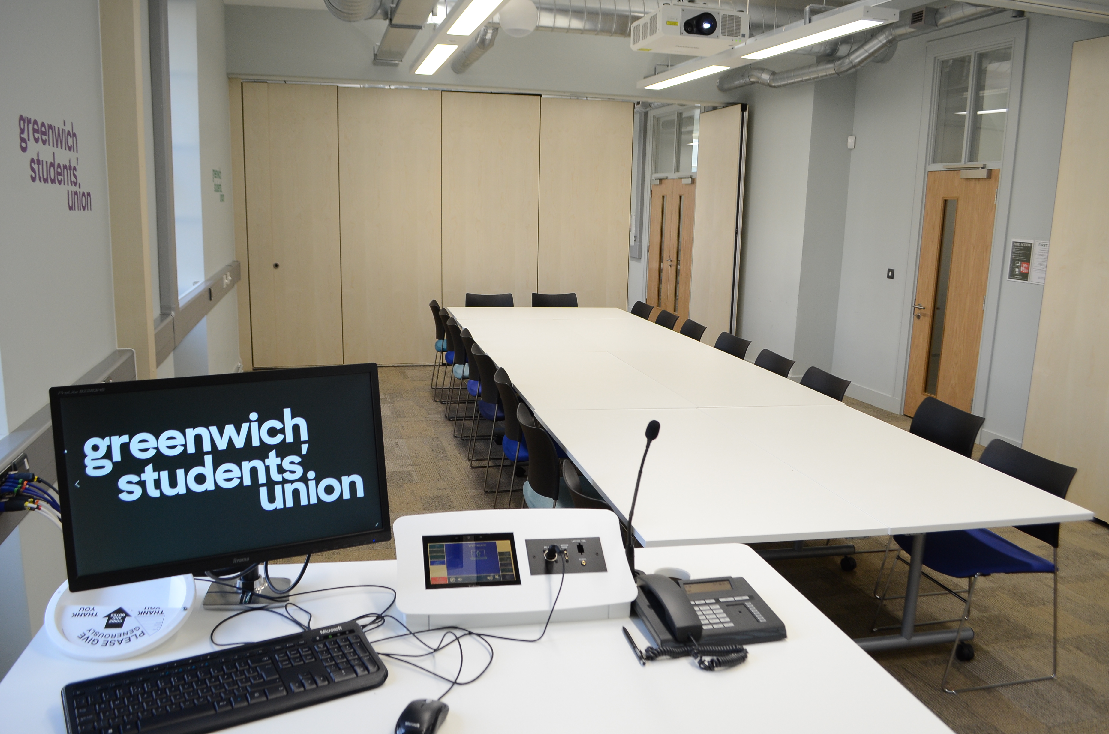 Modern Board Room in Dreadnought with long table for collaborative meetings and presentations.