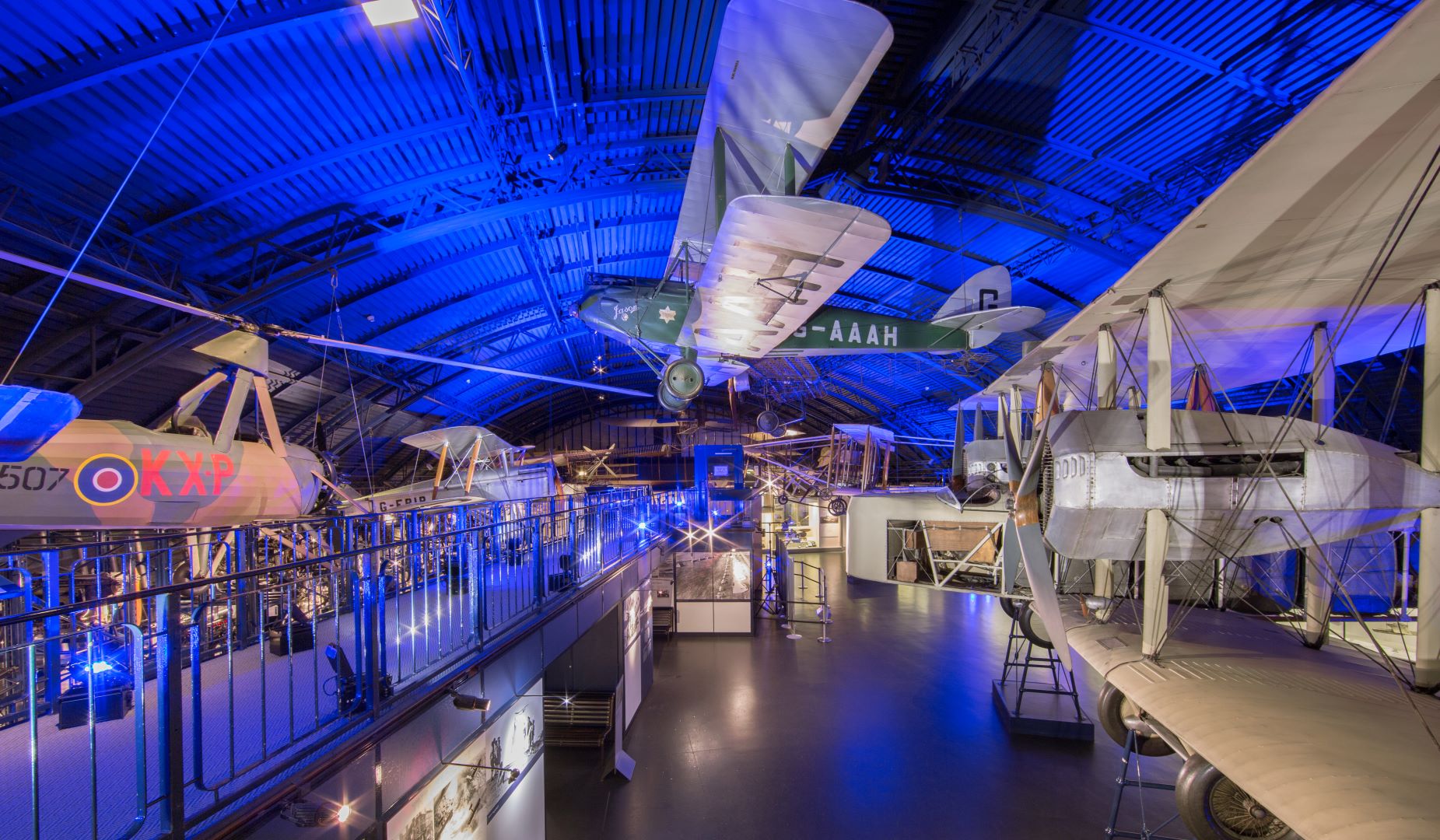 Vintage aircraft event space with blue lighting at The Science Museum for corporate gatherings.