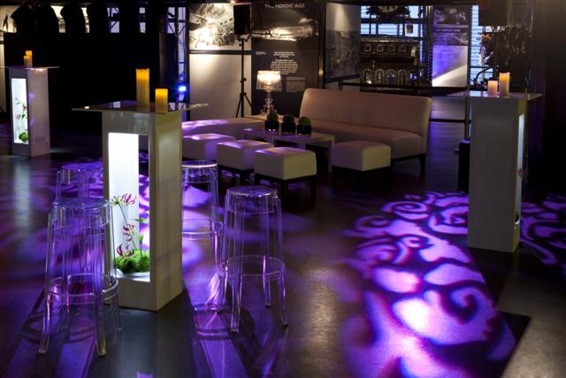 Stylish event space with sleek furniture and ambient lighting for upscale gatherings.