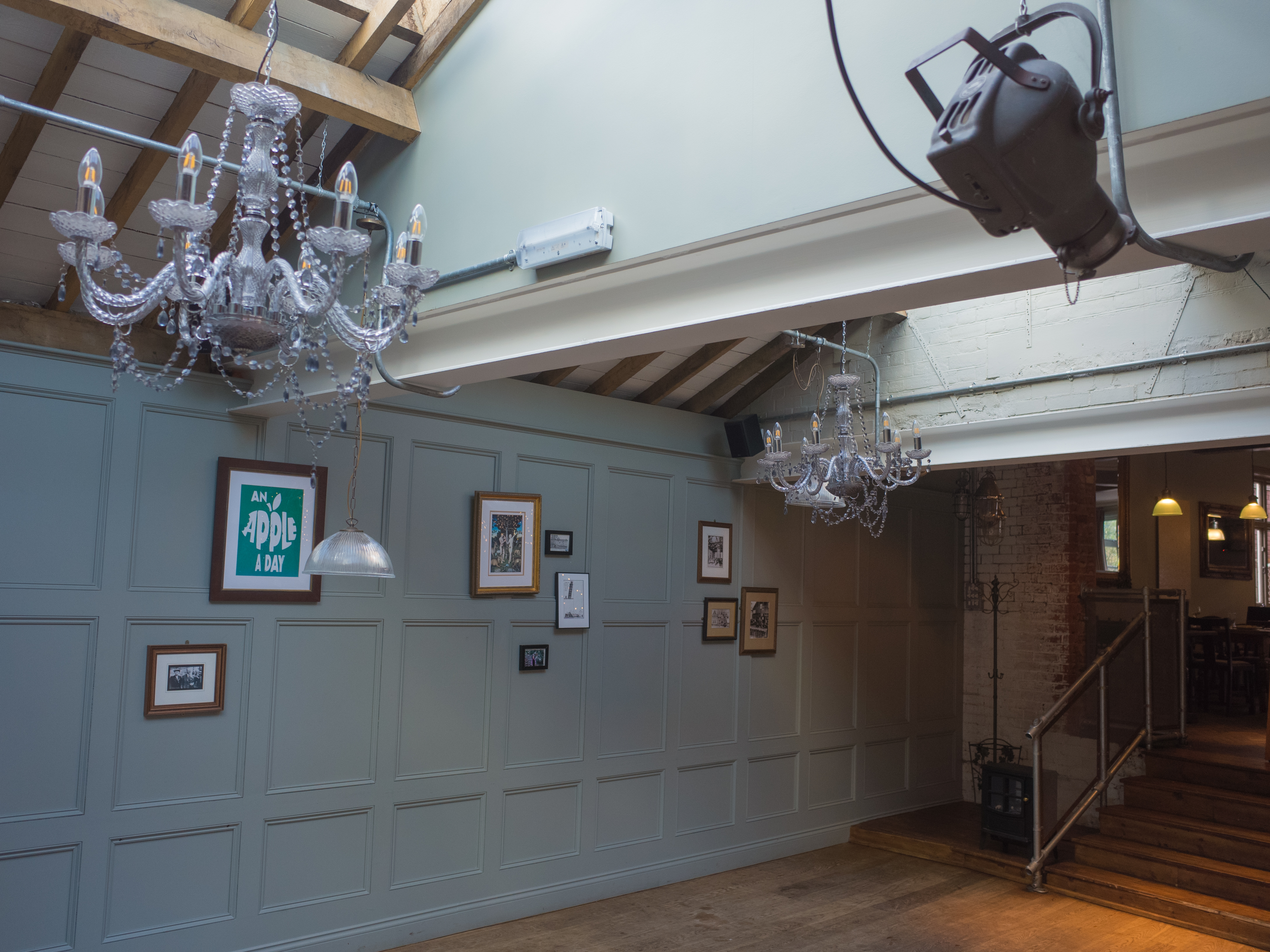 Stylish event space with chandeliers, perfect for meetings and gatherings at Adam & Eve.