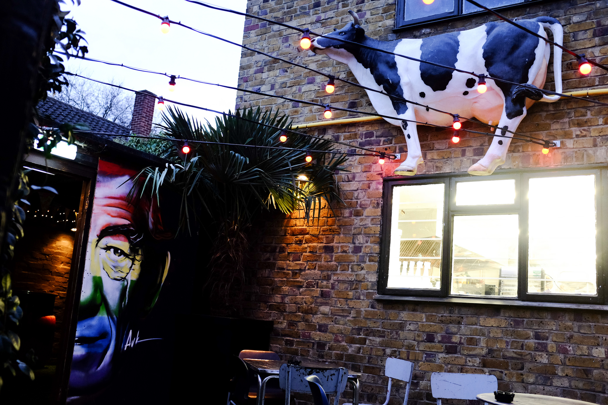 Semi-private garden at Ladywell Tavern with eclectic decor for casual events.