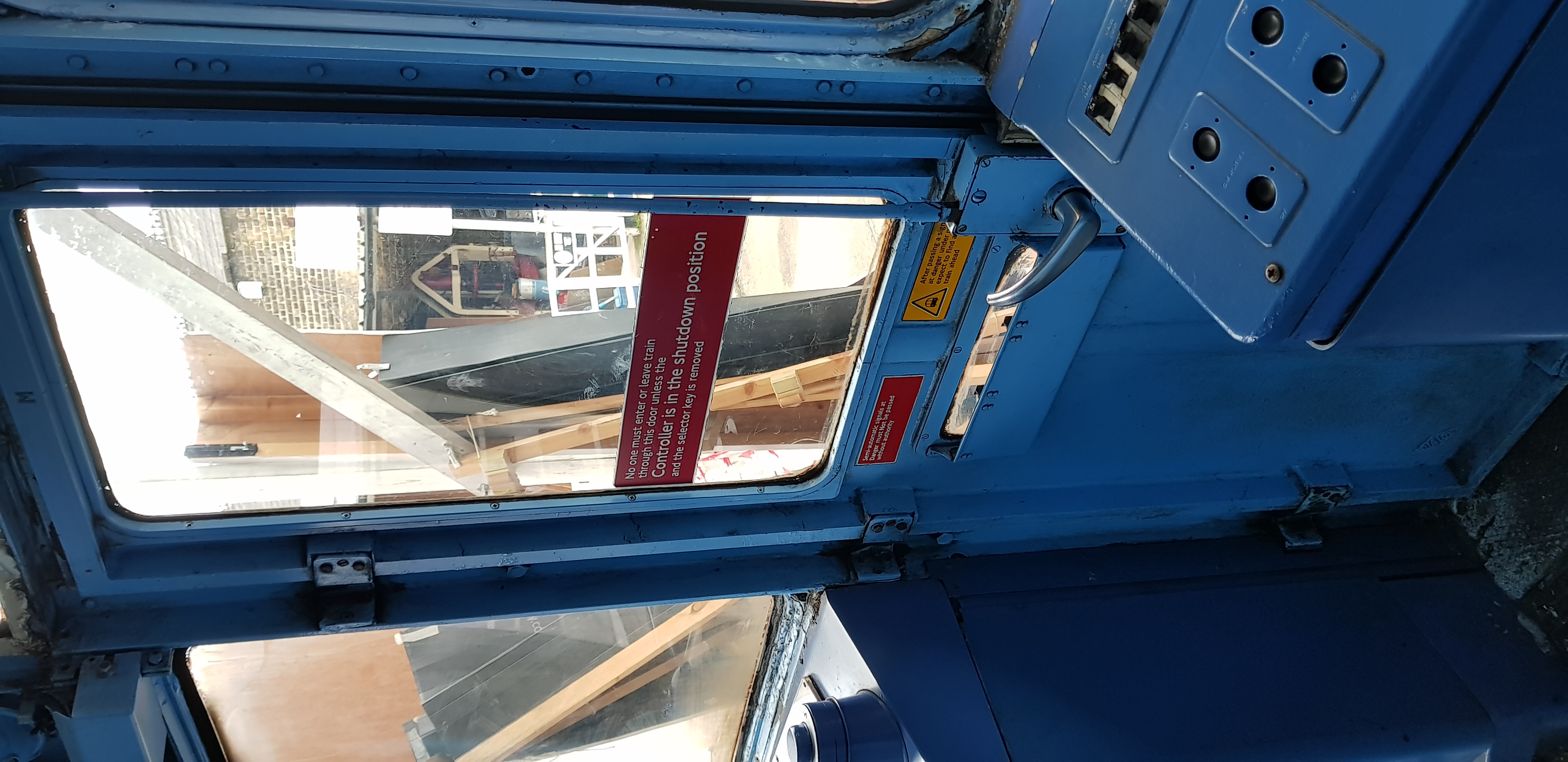 Victoria Line cab door with safety signage at Walthamstow Pumphouse Museum event.
