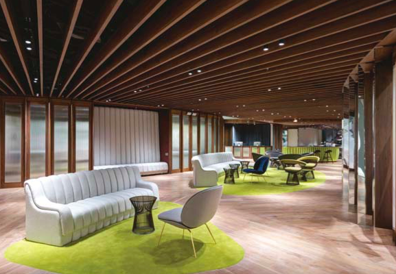Contemporary lounge space with color-blocked flooring for corporate networking and VIP events.