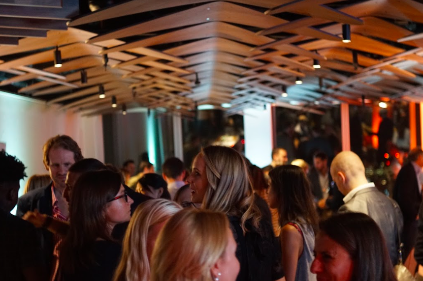Modern networking reception at The Shard with architectural ceilings for corporate events.