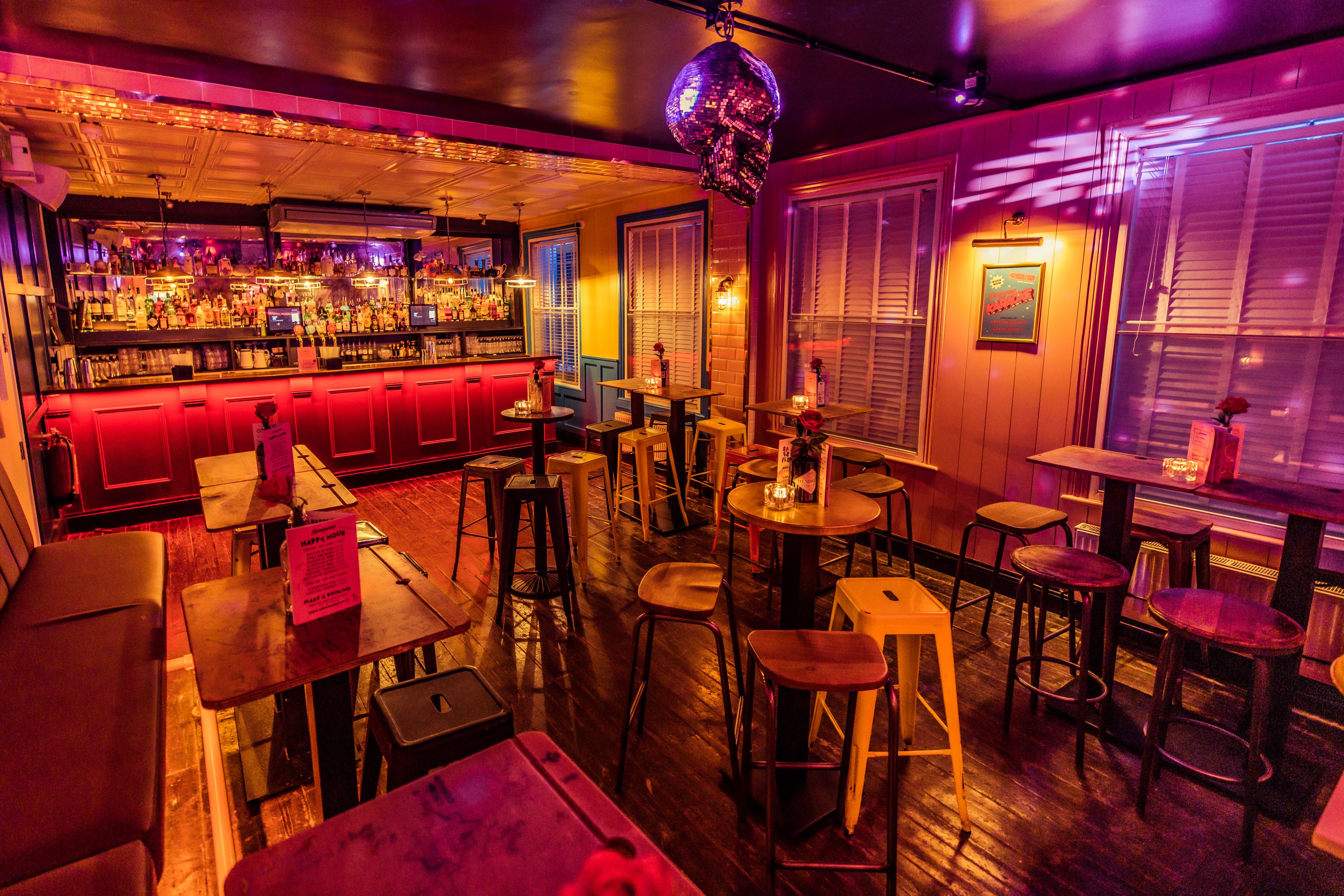 Vibrant event space in Simmons | Soho with stylish bar, ideal for networking and gatherings.