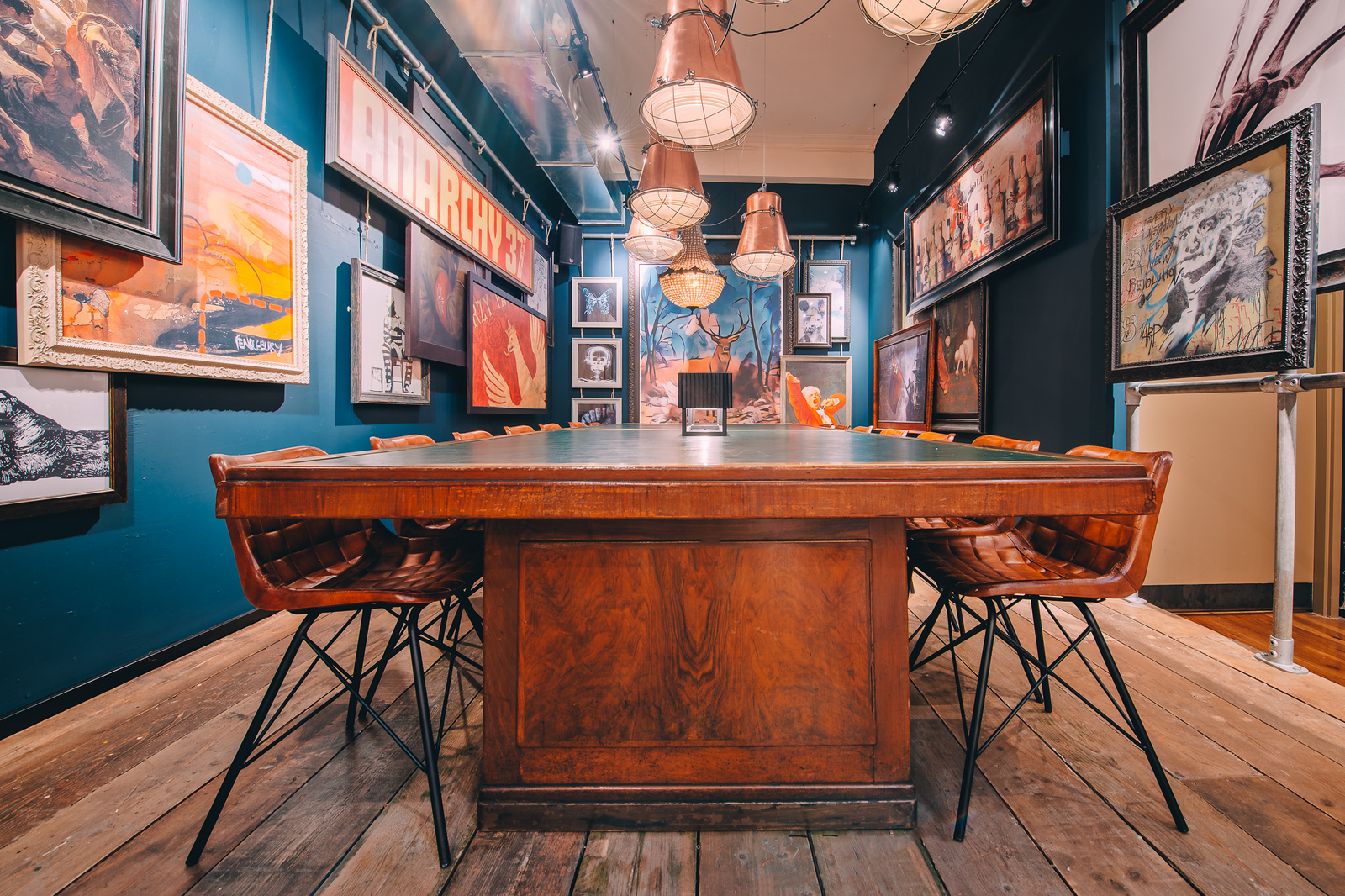 Stylish meeting room in Glasgow library with wooden table, ideal for creative gatherings.
