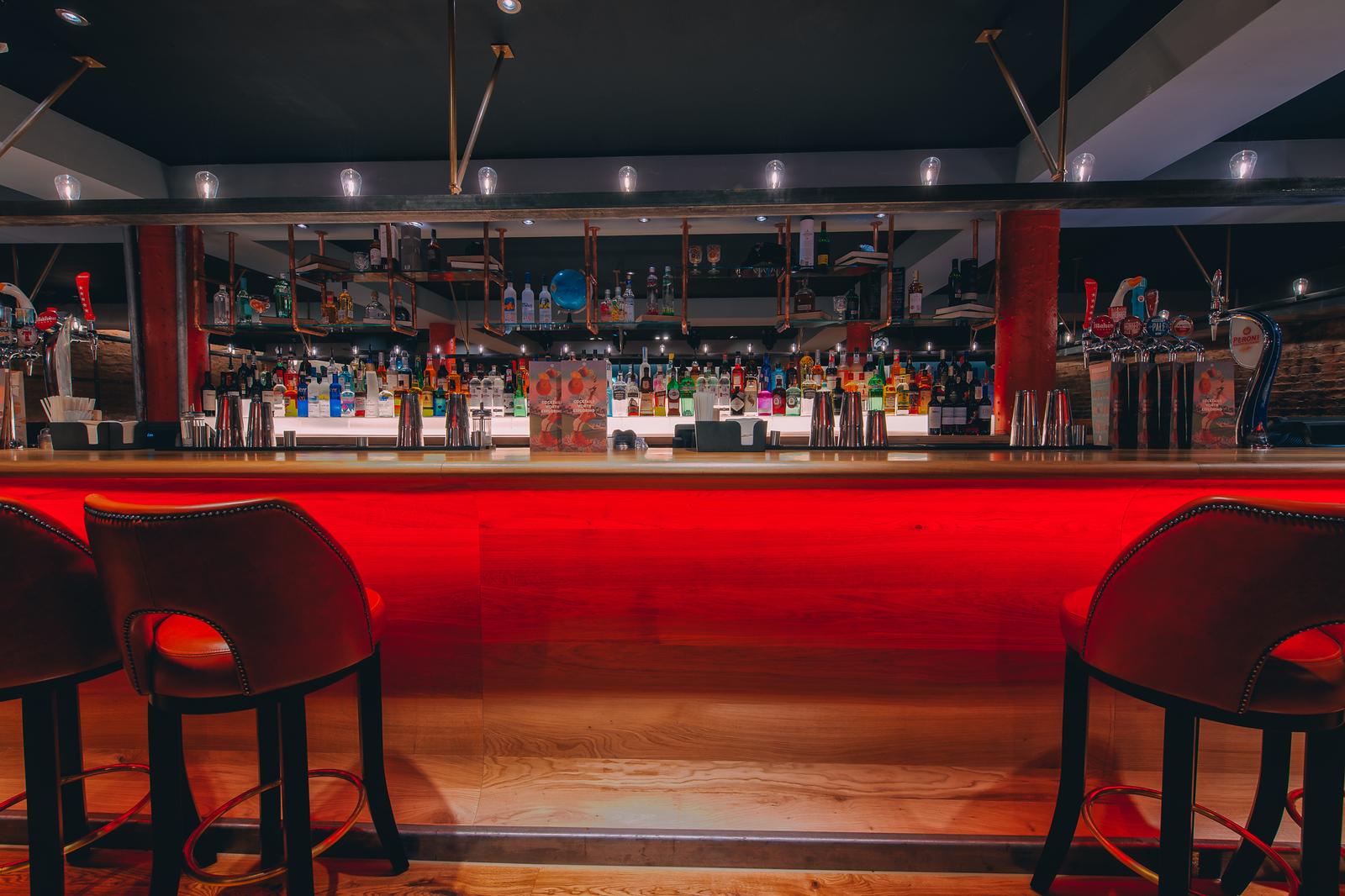 Sleek Skye Bar in Glasgow with illuminated counter for networking events and social gatherings.