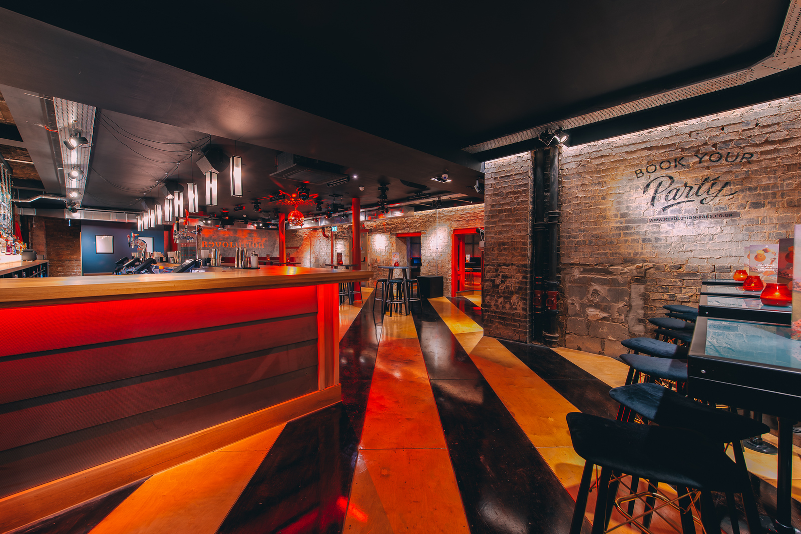 Stylish event space in Glasgow with modern bar, ideal for parties and corporate gatherings.